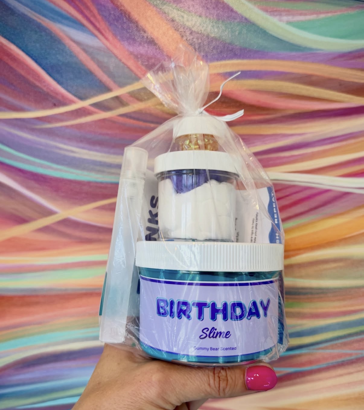 Birthday slime favor set with a jar of gummy bear scented slime and activator pen