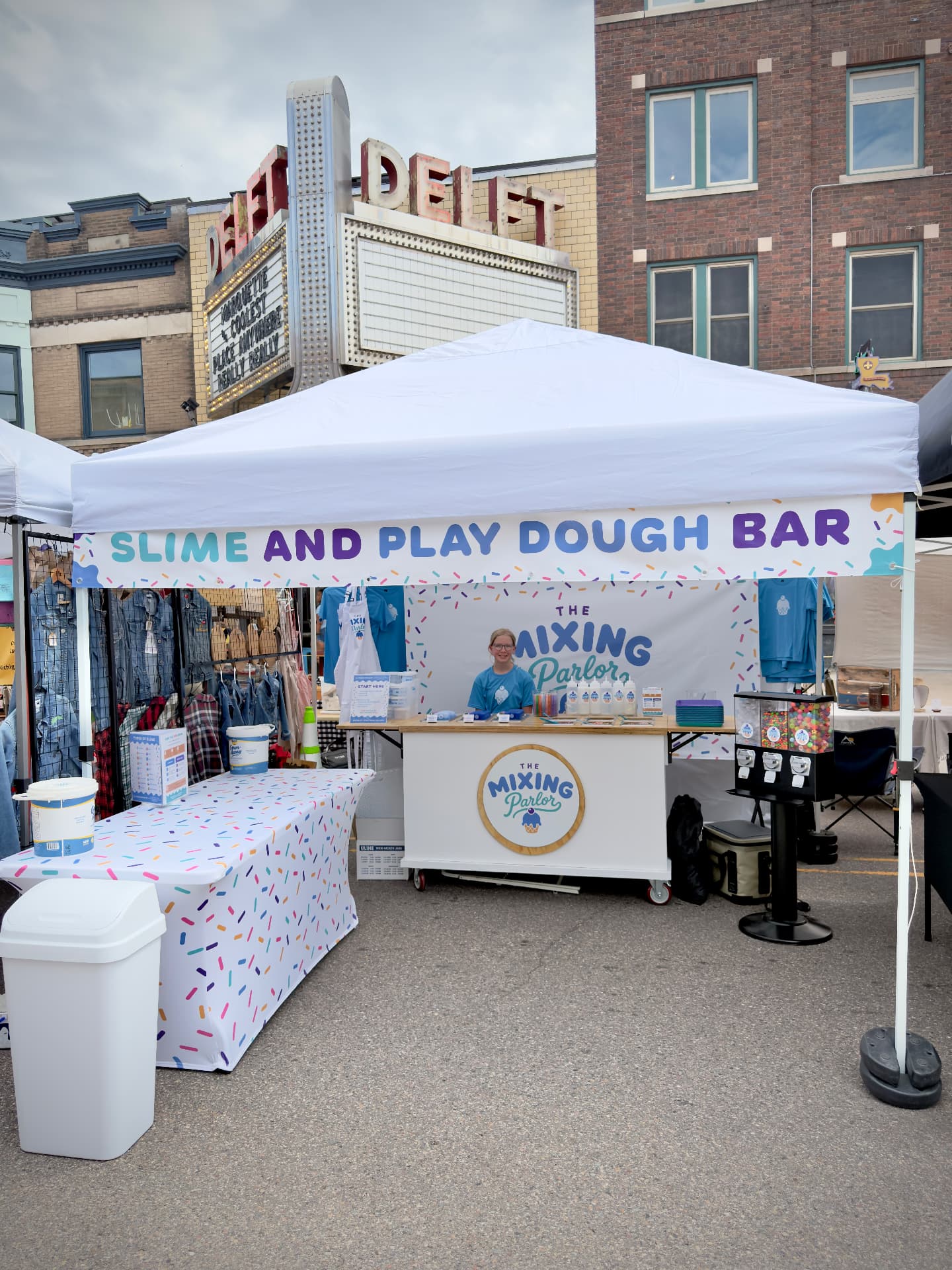 The Mixing Parlor slime and play dough bar tent at a street market