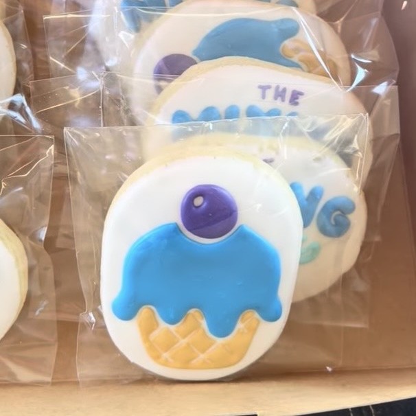 Decorated sugar cookies with The Mixing Parlor scoop logo and ice cream cone design